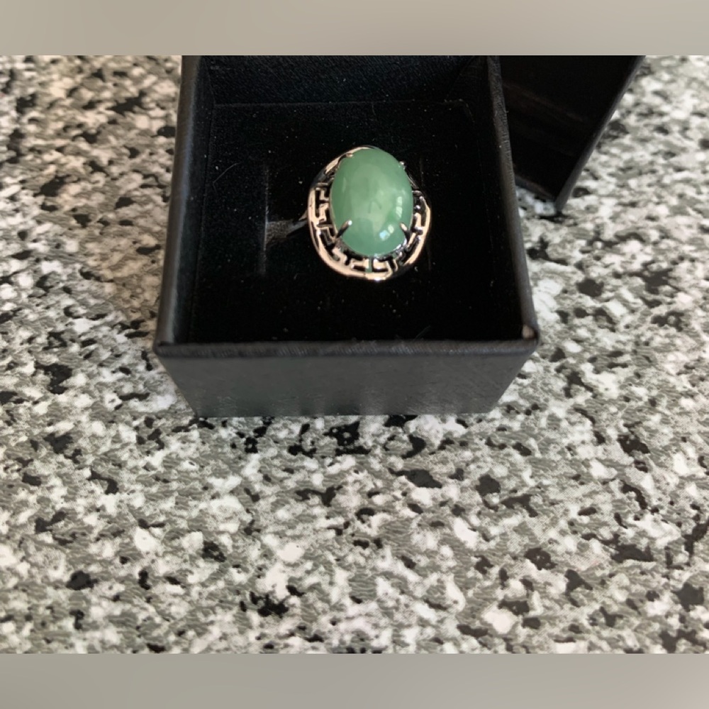 Jadeite ring in rhodium over sterling setting. Size 7